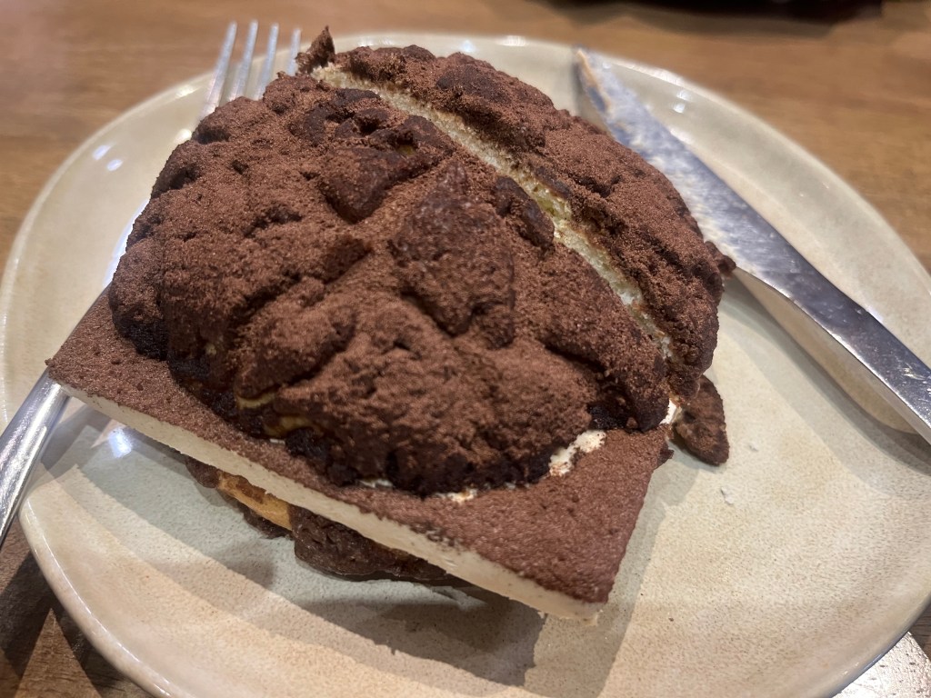 A delicious tiramisu bunon a plate.